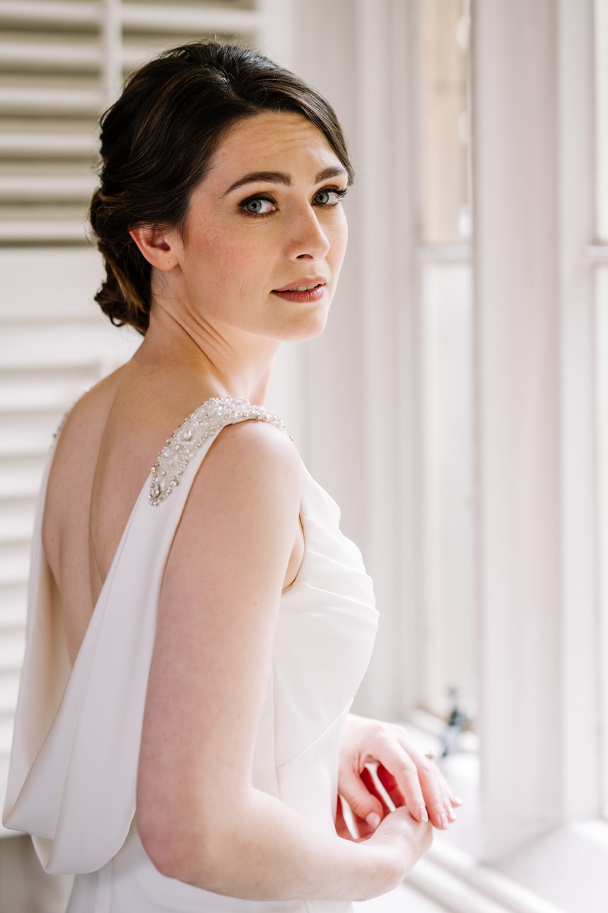 SUMMER WEDDING AT THE SWAN HOTEL BIBURY 13 Close-up profile portrait of a bride on her summer wedding at the Swan Hotel Bibury.