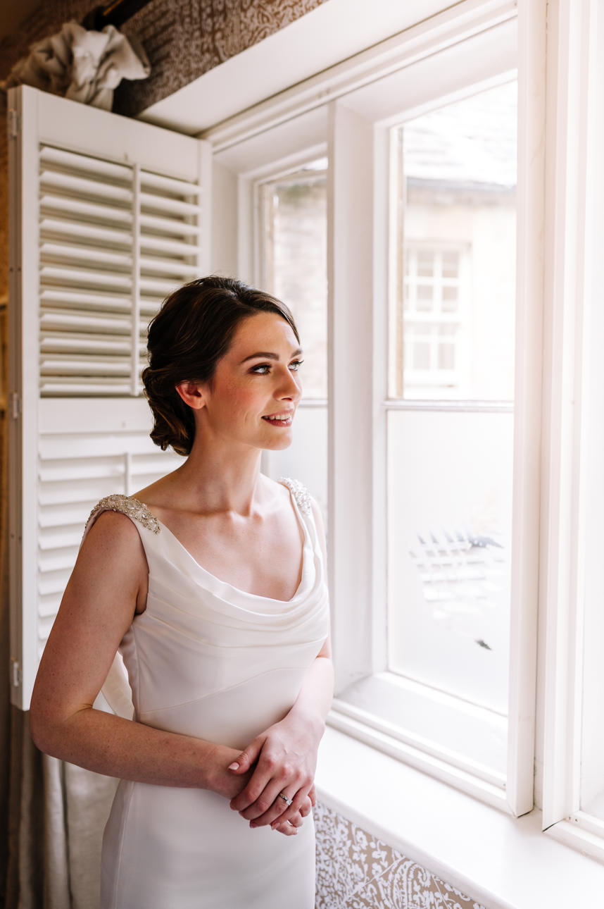 SUMMER WEDDING AT THE SWAN HOTEL BIBURY 14 Close-up profile portrait of a bride on her summer wedding at the Swan Hotel Bibury.