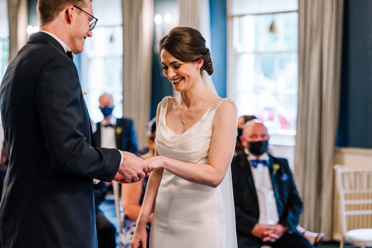 SUMMER WEDDING AT THE SWAN HOTEL BIBURY 26 ring exchange at the swan hotel bibury