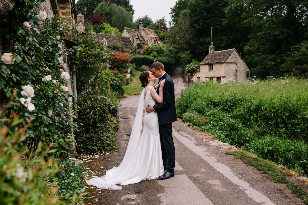 SUMMER WEDDING AT THE SWAN HOTEL BIBURY 36 Intimate and romantic black and white embrace of the bride and groom at their summer wedding at the Swan Hotel Bibury.