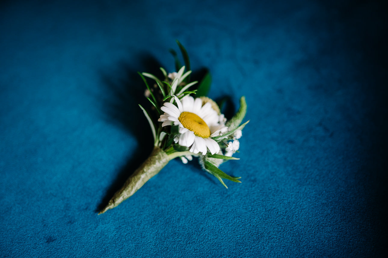 SUMMER WEDDING AT THE SWAN HOTEL BIBURY 10 Elegant white floral boutonniere or buttonhole detail for a summer wedding at the Swan Hotel Bibury.