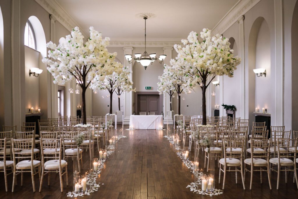 A CHRISTMAS WINTER WEDDING AT THE KINGS HEAD 17 Elegant wedding ceremony room at the Kings Head Hotel decorated with white blossom and candles
