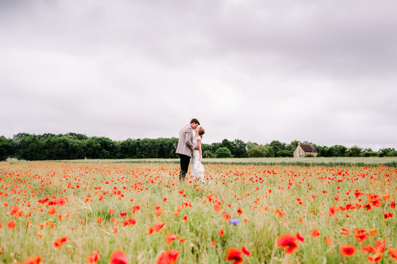Lapstone Barn wedding couple in filed of poppies_gallery page