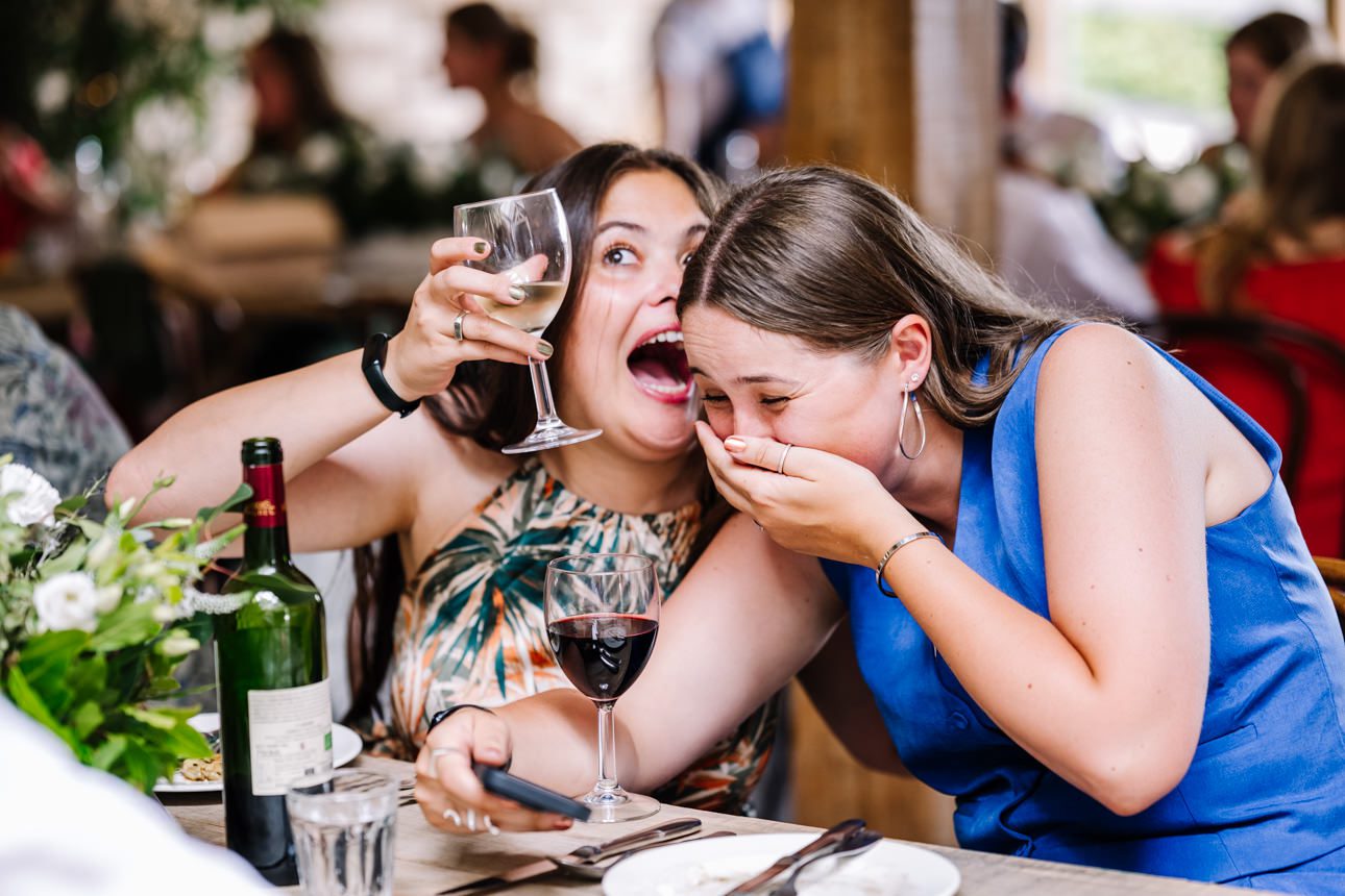 Two women enjoying drinks together.