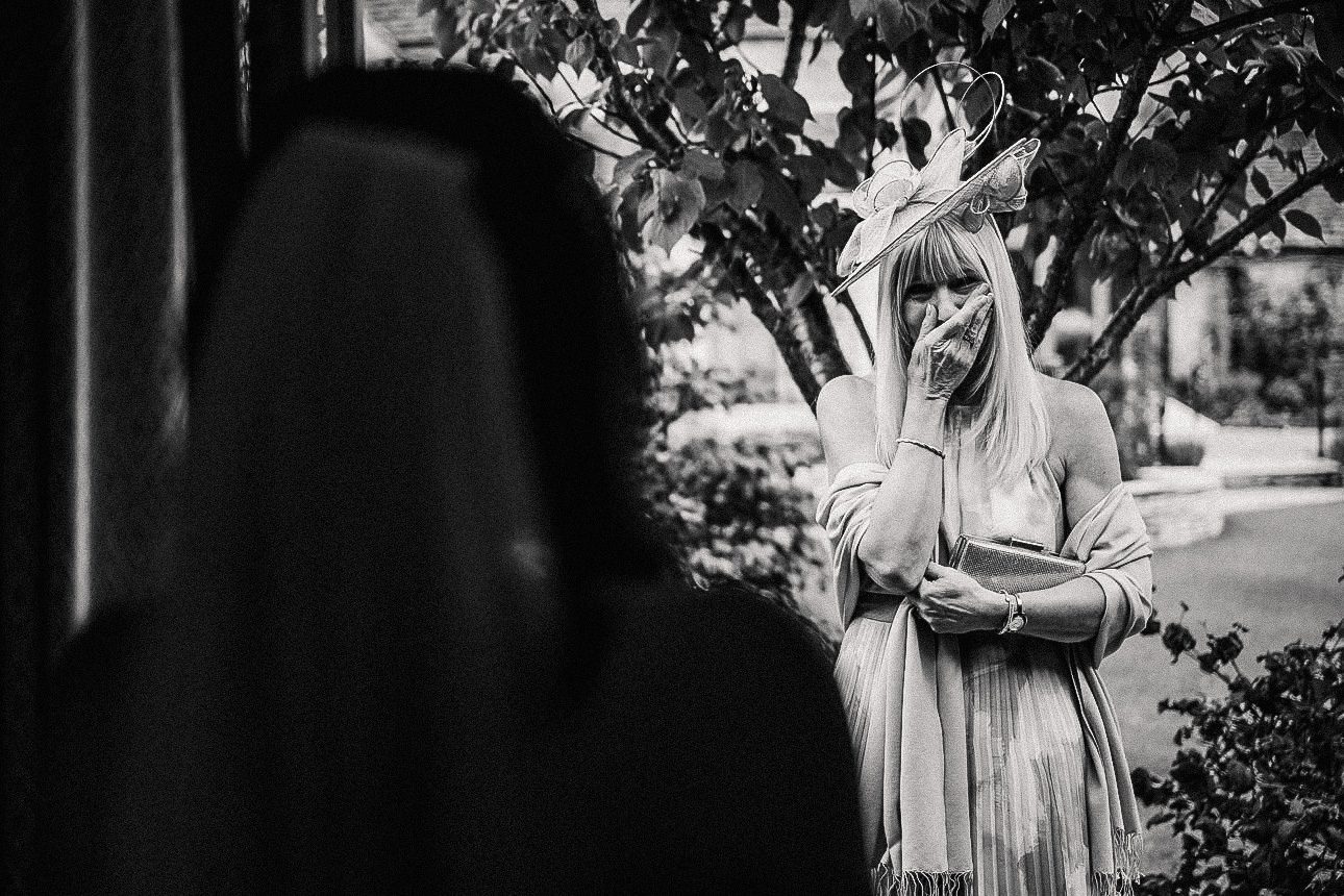mother of the bride seeing her daughter in her wedding dress