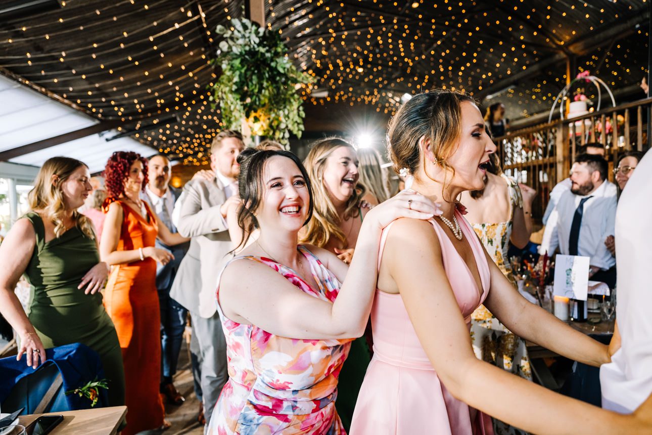 Wedding celebration with dancing guests.