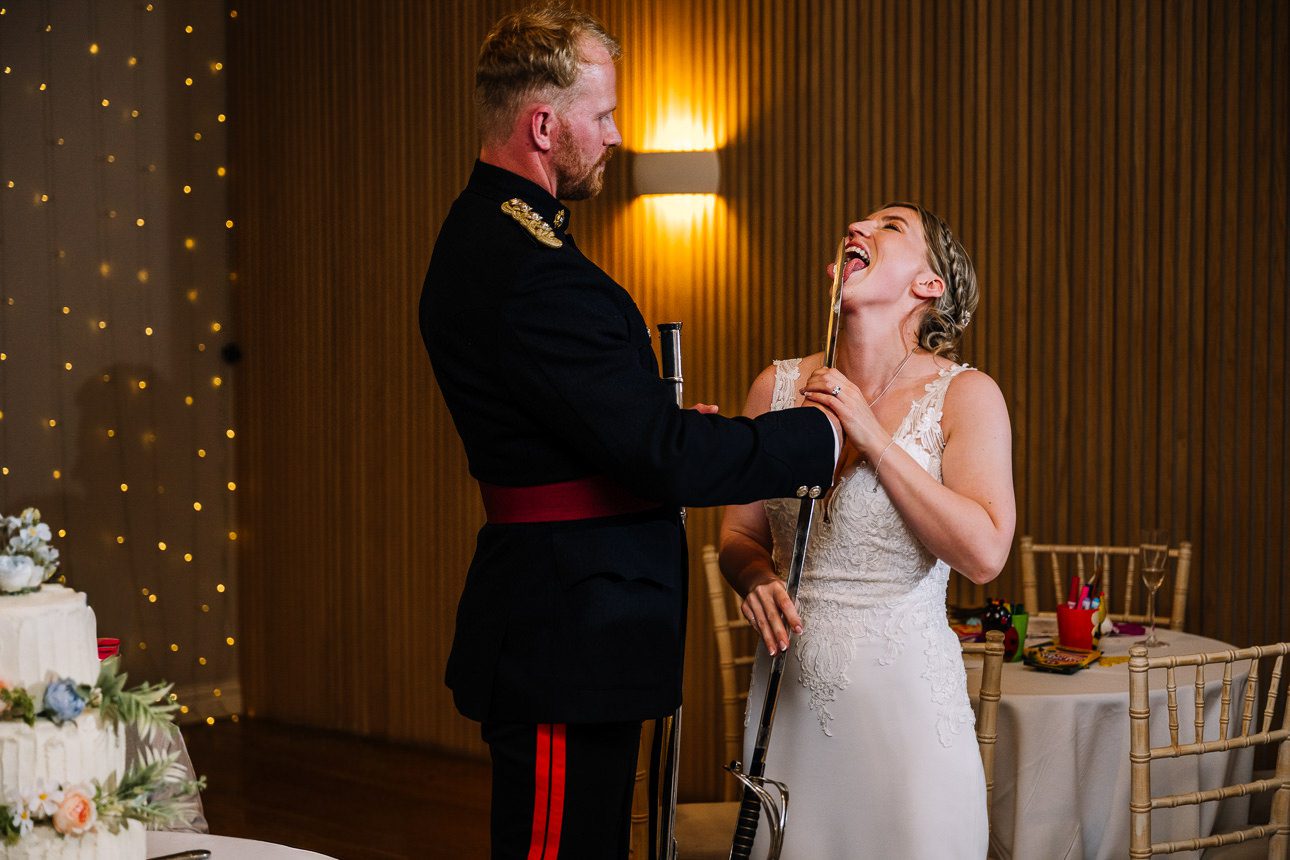 bride and groom cutting the cake