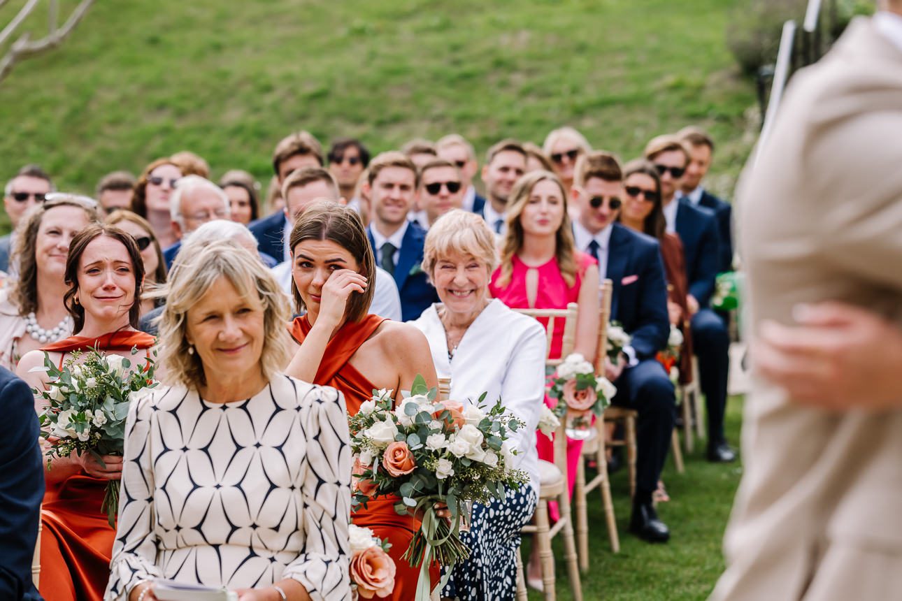 guest crying during a wedding ceremony