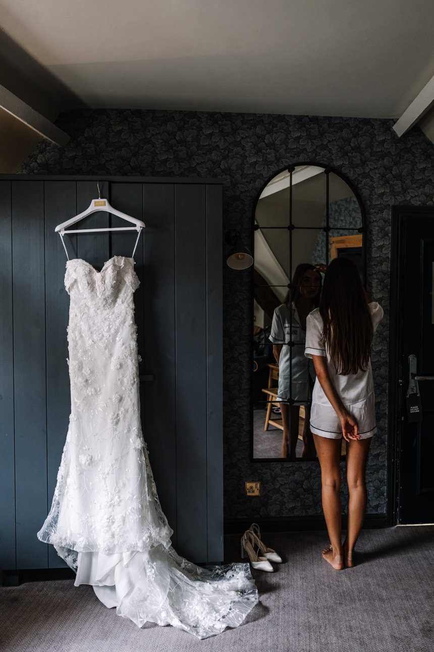 bride looking at her wedding dress