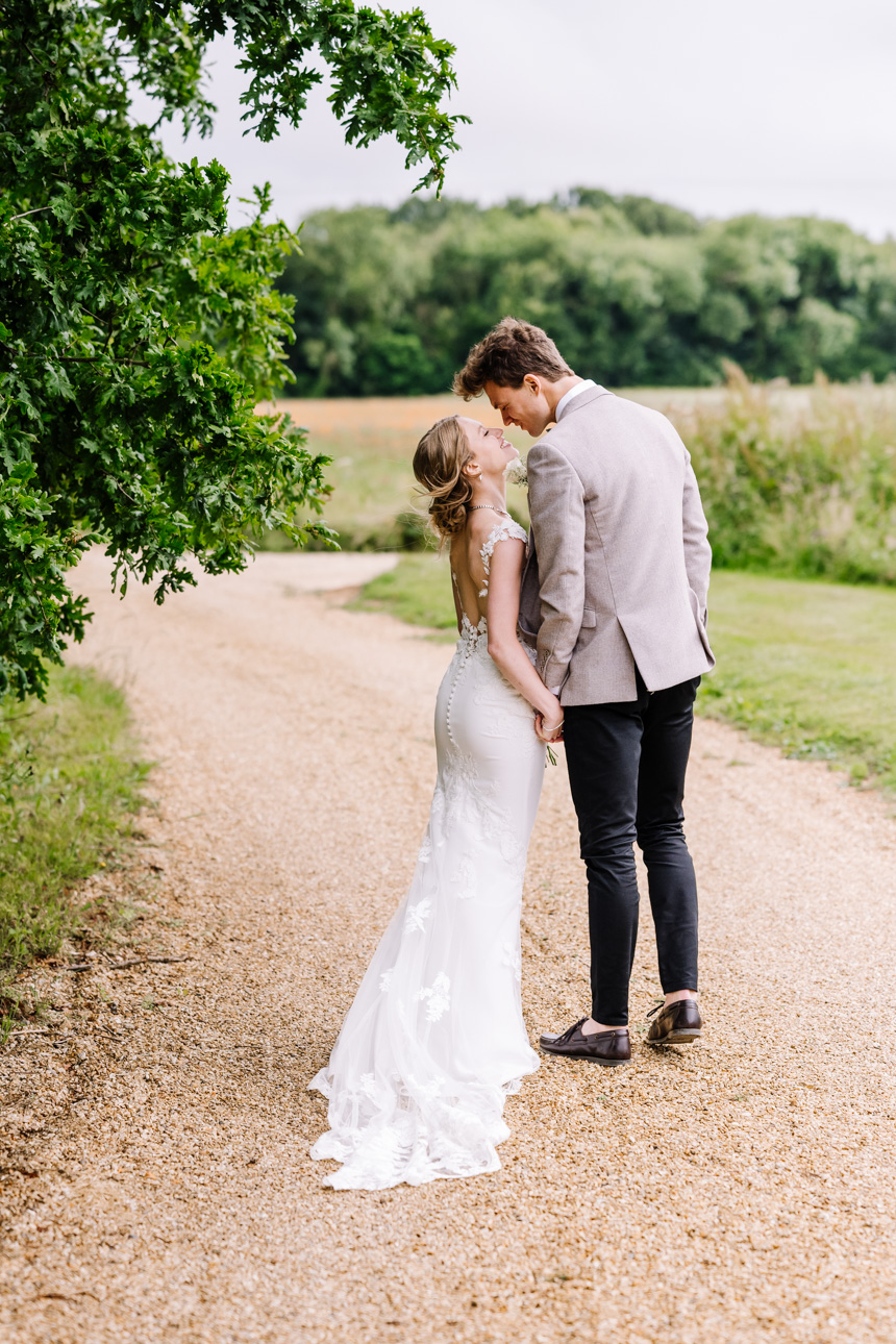 LAPSTONE BARN WEDDING PHOTOGRAPHER 12 Newlywed couple embracing at Lapstone Barn
