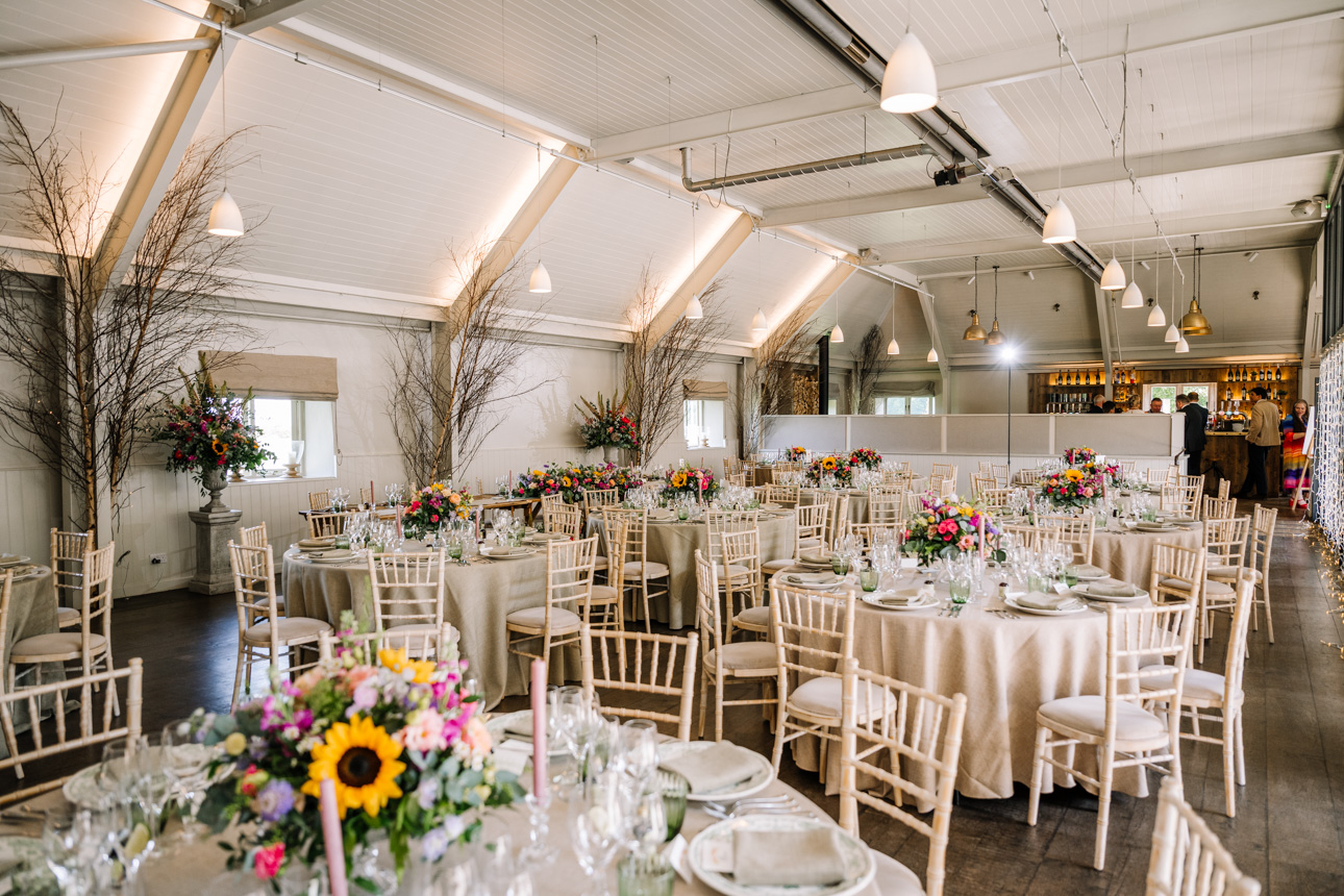 LAPSTONE BARN WEDDING PHOTOGRAPHER 74 Elegant wedding reception setup inside the historic stone barn at Lapstone Barn, photographed by Tanli Joy Weddings.