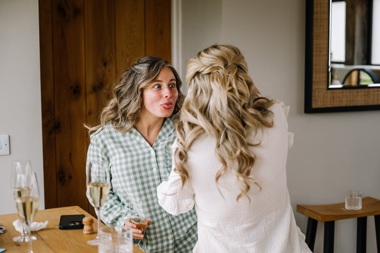 FLORA AND WILLIAM PRIMROSE HILL FARM SPRING WEDDING 14 Bride Flora getting ready with her bridesmaids at Primrose Hill Farm