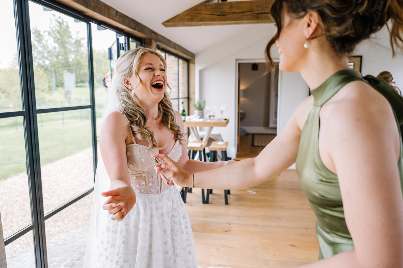 FLORA AND WILLIAM PRIMROSE HILL FARM SPRING WEDDING 16 Bride Flora getting ready with her bridesmaids at Primrose Hill Farm