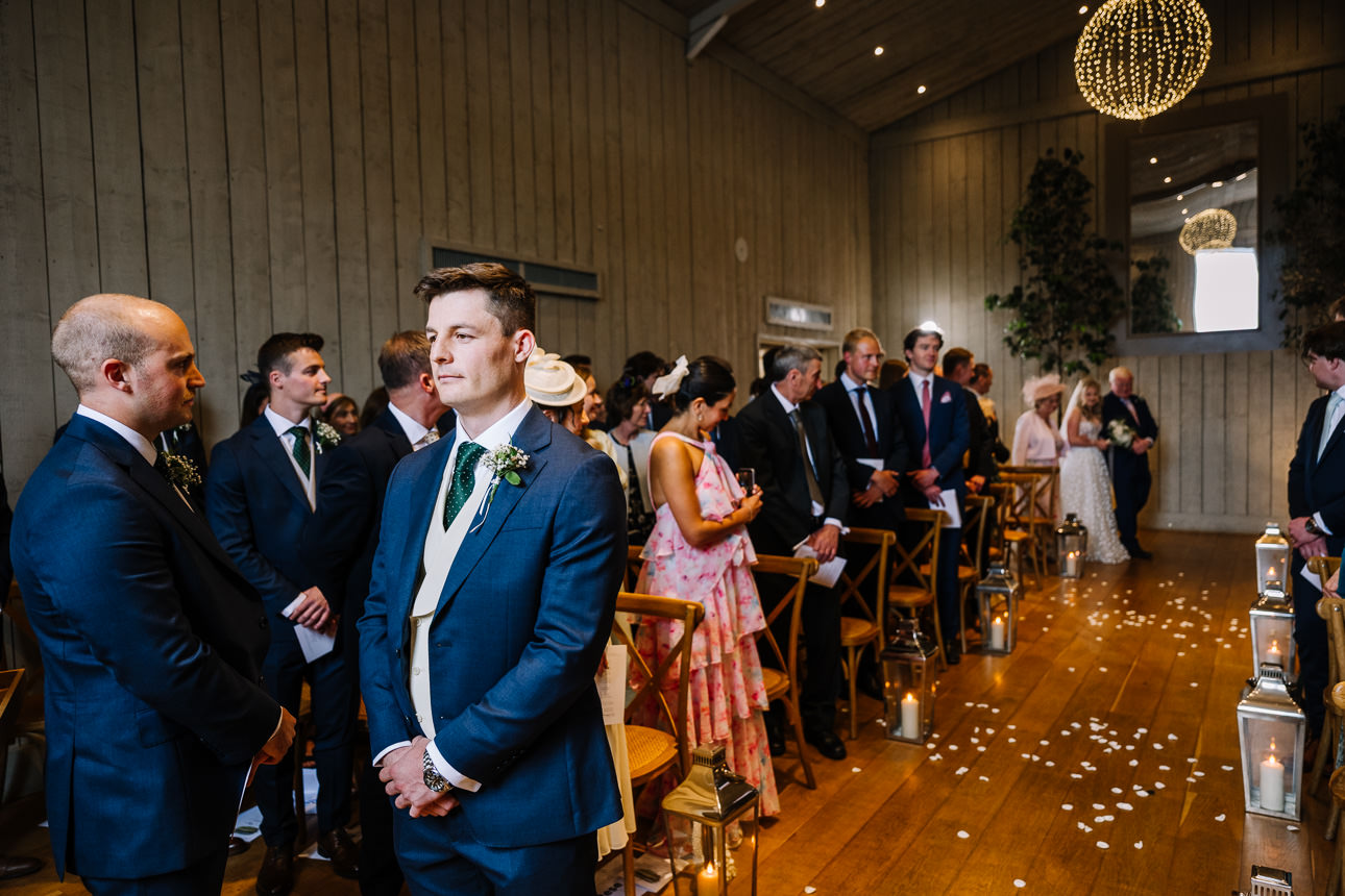 FLORA AND WILLIAM PRIMROSE HILL FARM SPRING WEDDING 20 Wedding ceremony inside the beautiful reception space at Primrose Hill Farm