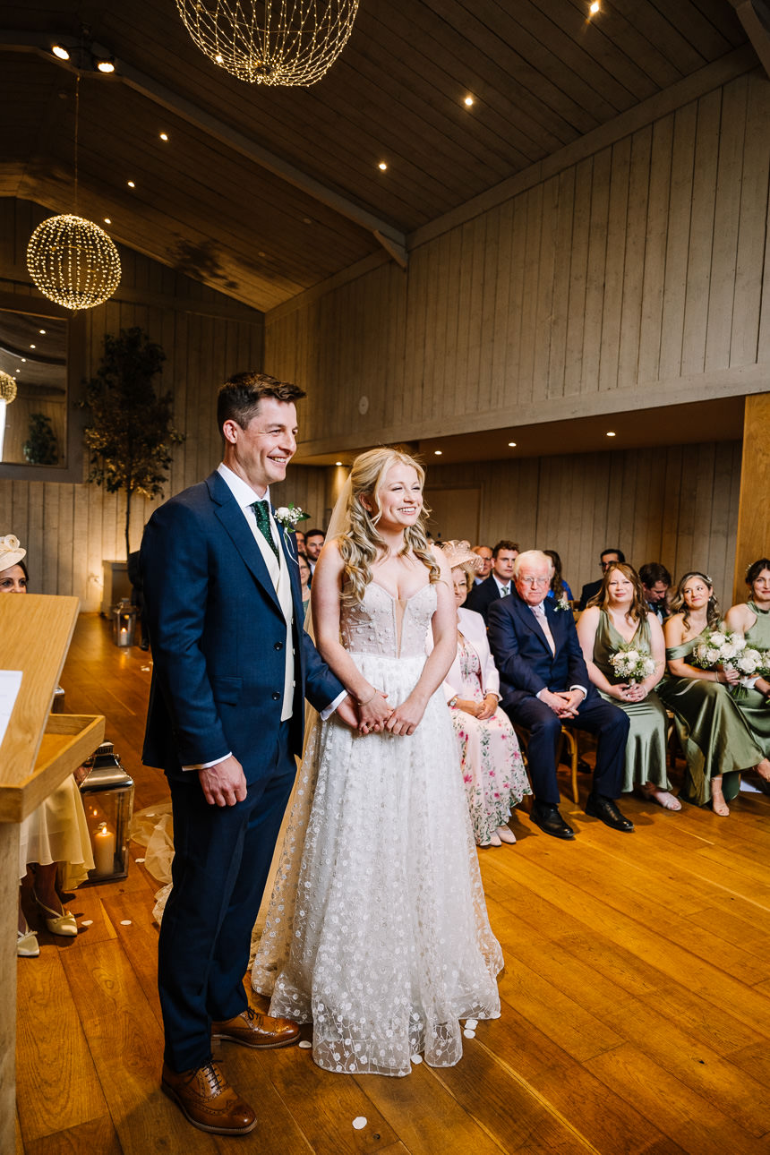 FLORA AND WILLIAM PRIMROSE HILL FARM SPRING WEDDING 27 Bride and groom smiling together after their wedding ceremony