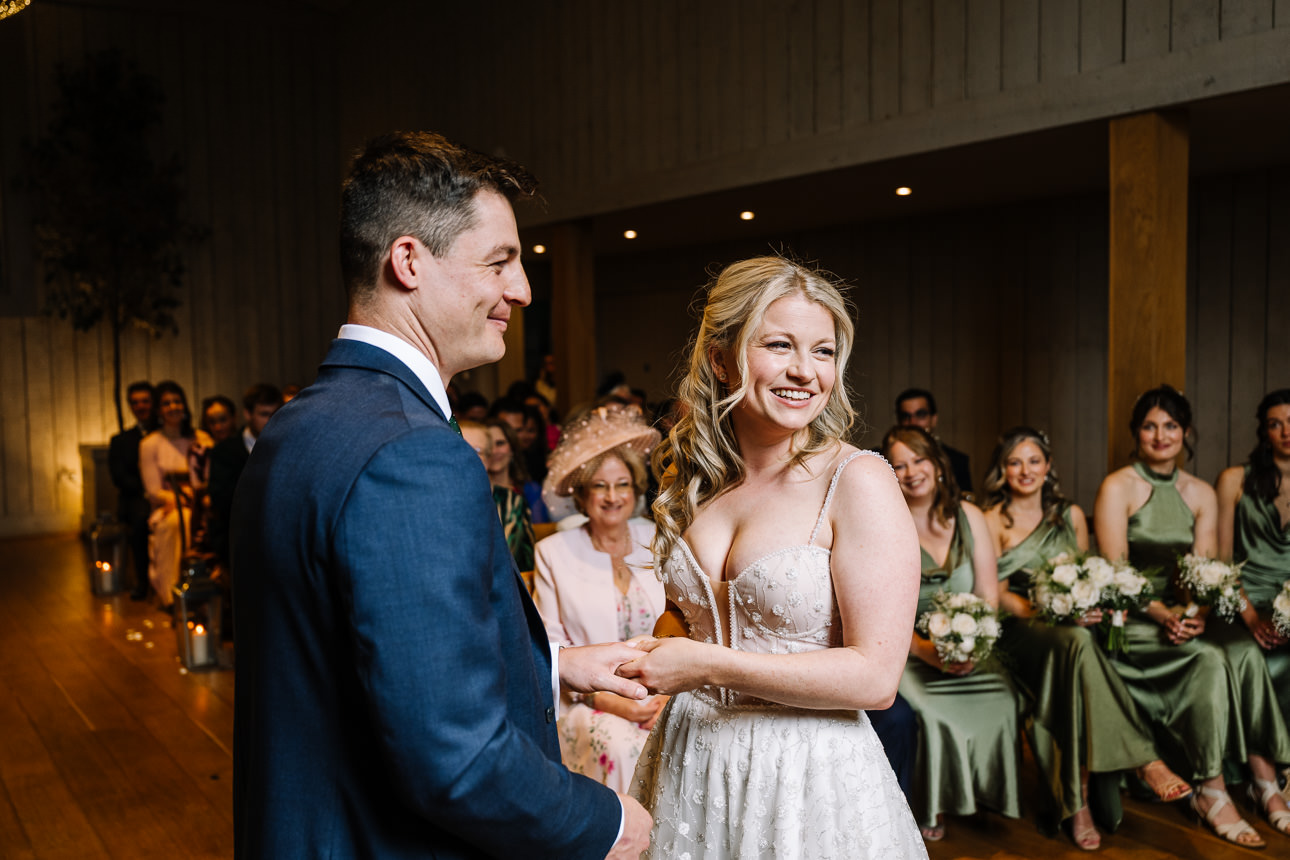 FLORA AND WILLIAM PRIMROSE HILL FARM SPRING WEDDING 29 Bride and groom smiling at each other during their Primrose Hill Farm wedding