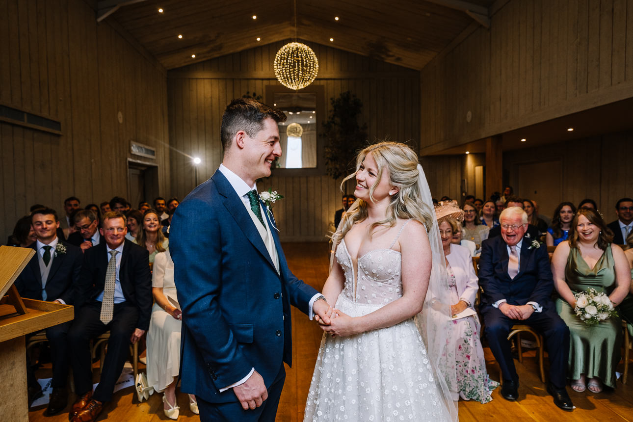 FLORA AND WILLIAM PRIMROSE HILL FARM SPRING WEDDING 31 Bride and groom laughing together during their spring wedding at Primrose Hill Farm