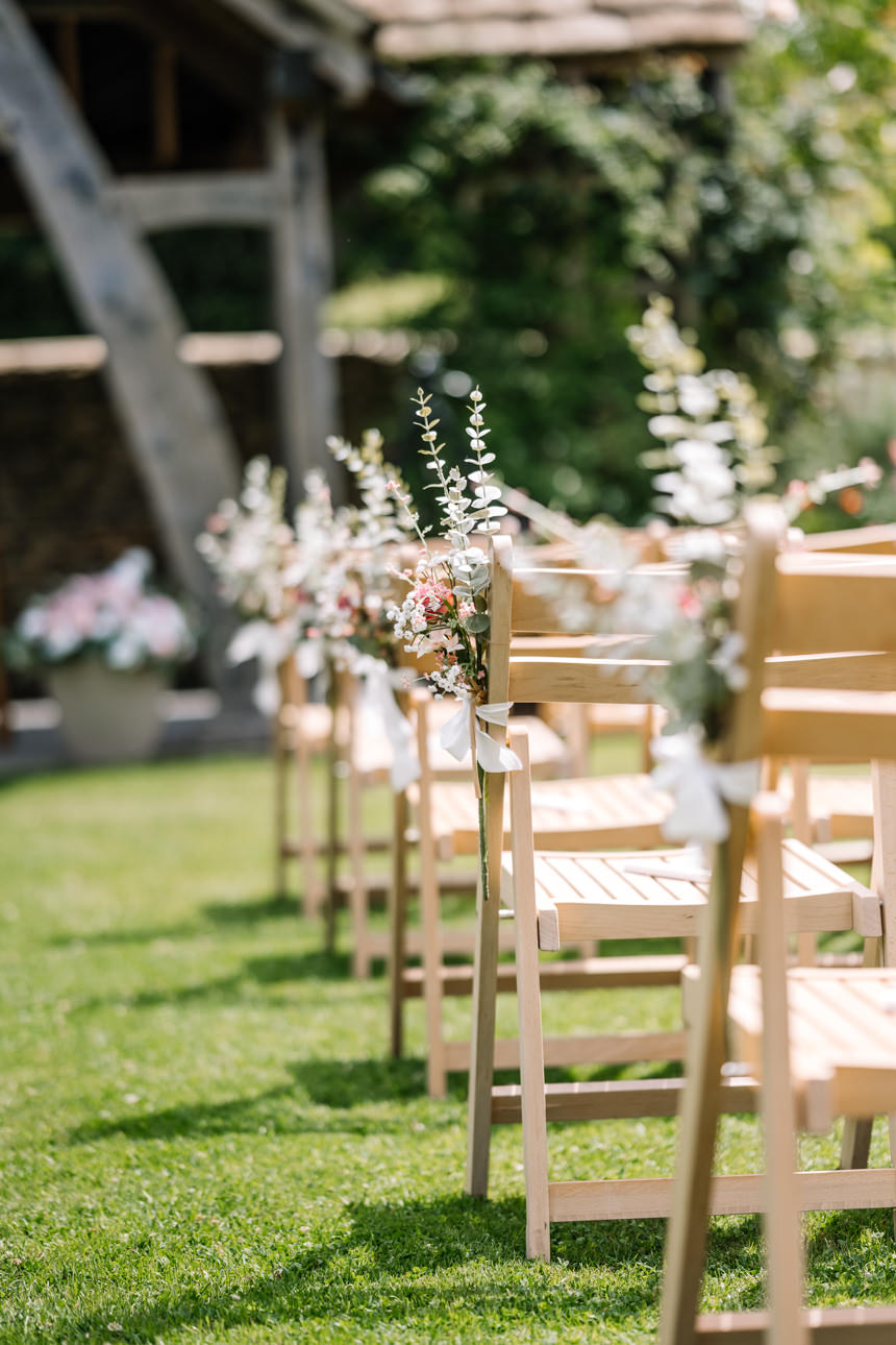 GREAT TYTHE BARN WEDDING PHOTOGRAPHER 38 A wide perspective looking down the grassy wedding aisle towards the beautiful outdoor Oak Pavilion at The Great Tythe Barn.