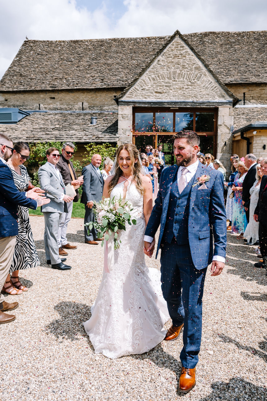 GREAT TYTHE BARN WEDDING PHOTOGRAPHER 45 Confetti walk at Great Tythe Barn tetbury.