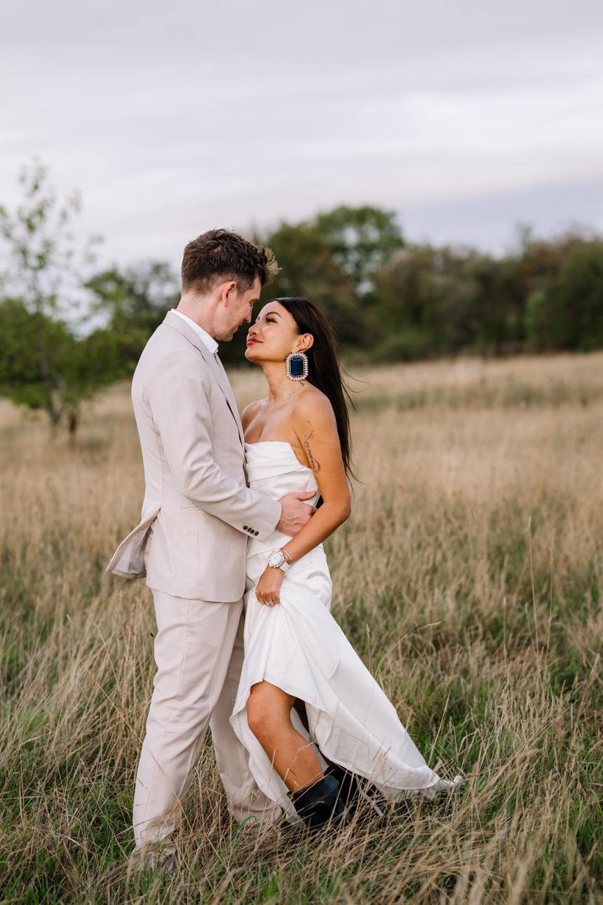 OXLEAZE BARN WEDDING PHOTOGRAPHER 84 Natural wedding photo of couple embracing at Oxleaze Barn