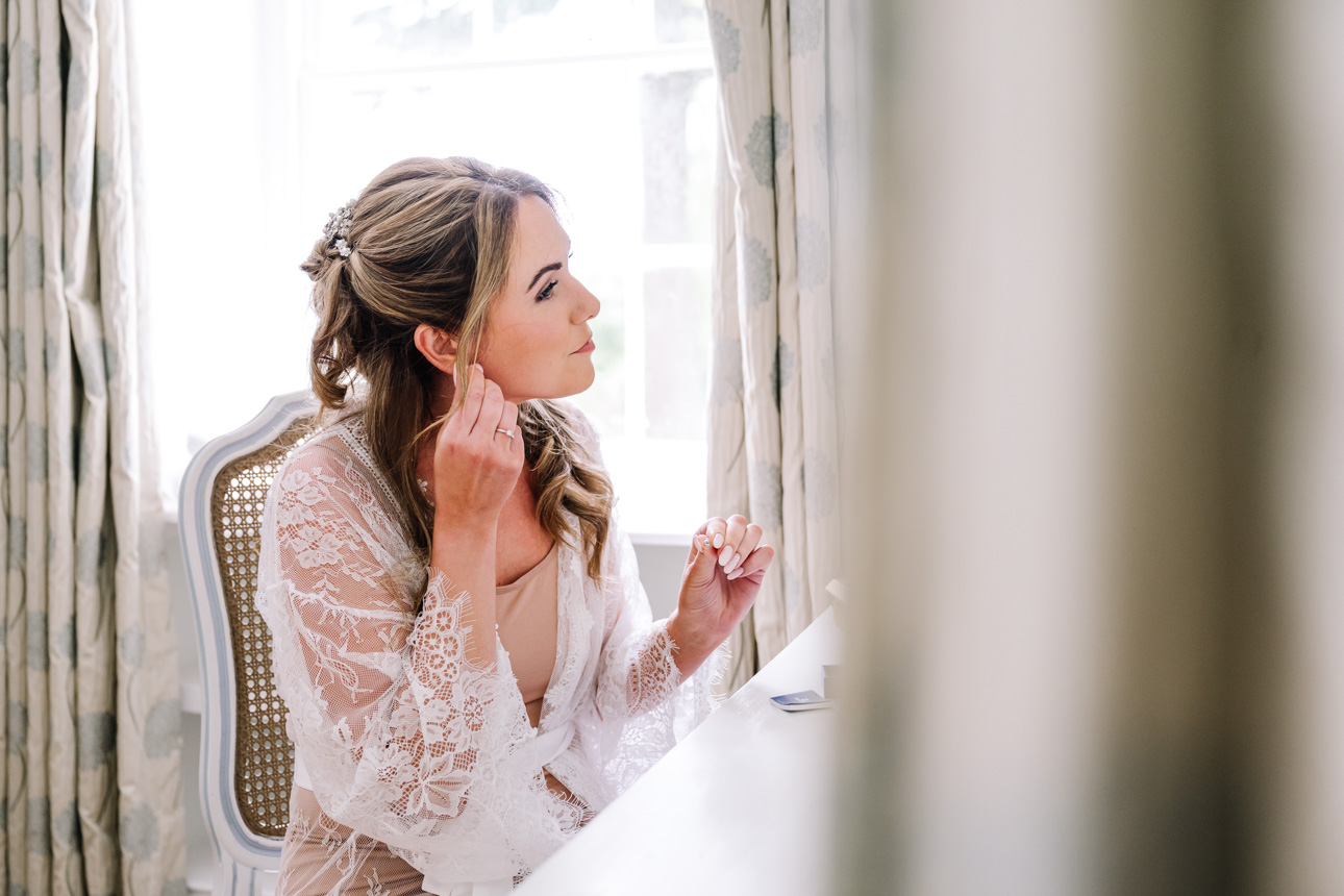GREAT TYTHE BARN WEDDING PHOTOGRAPHER 8 A stunning bridal portrait captured using soft directional window light inside the luxury accommodation at The Great Tythe Barn.