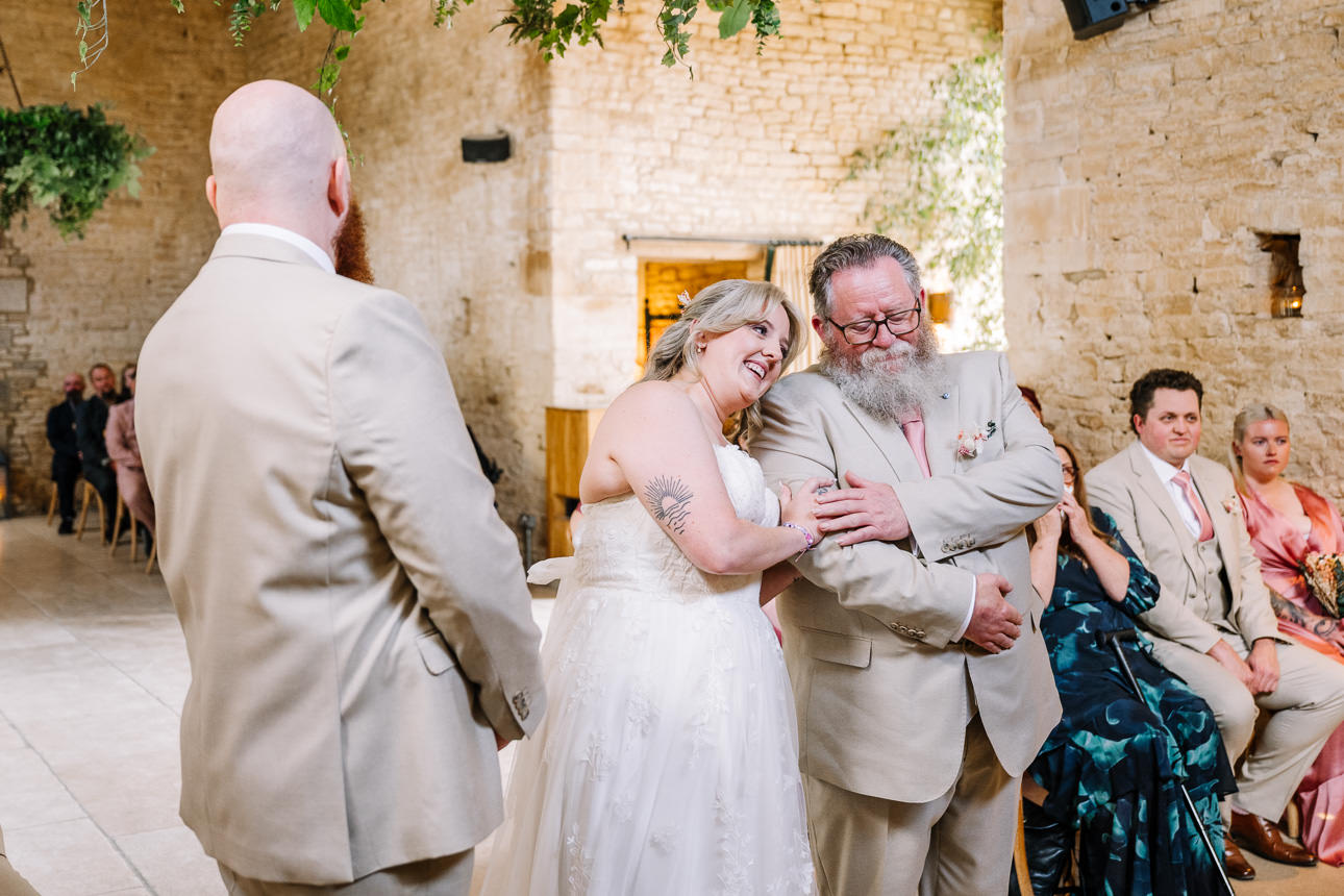 OLD GORE WEDDING PHOTOGRAPHER 39 bride embracing her father at the wedding ceremony at old gore barn