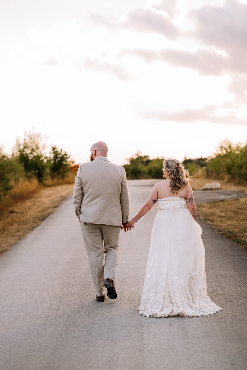 OLD GORE WEDDING PHOTOGRAPHER 56 Couple walking hand in hand during golden hour at Old Gore Barn