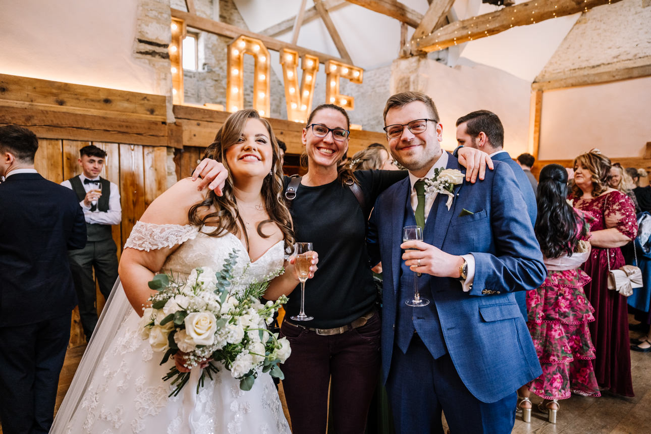 ABOUT 63 Bride and Groom with their arms around Tanli Joy Photographer.