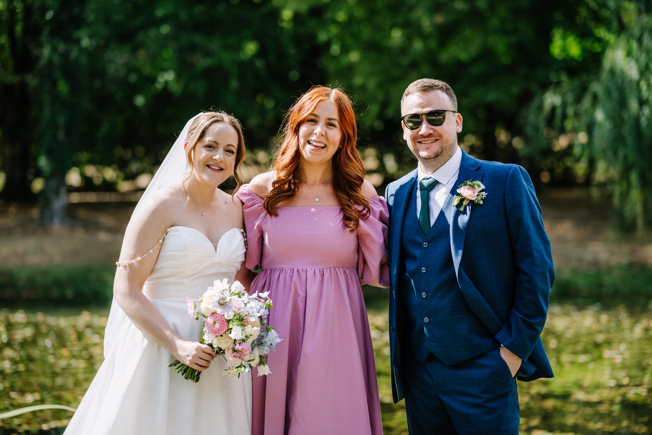 RECOMMENDED WEDDING SUPPLIERS 17 Celebrant Laura Crockett standing with bride and groom